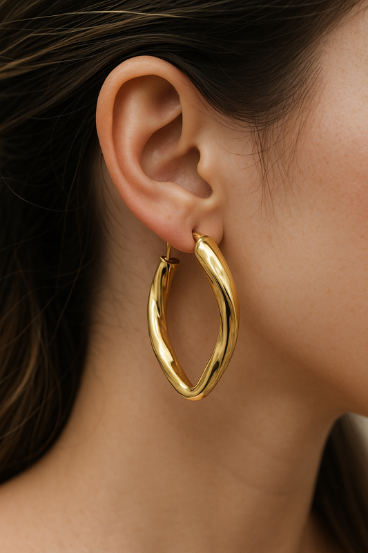 10k fancy polished twist oval hoop earring